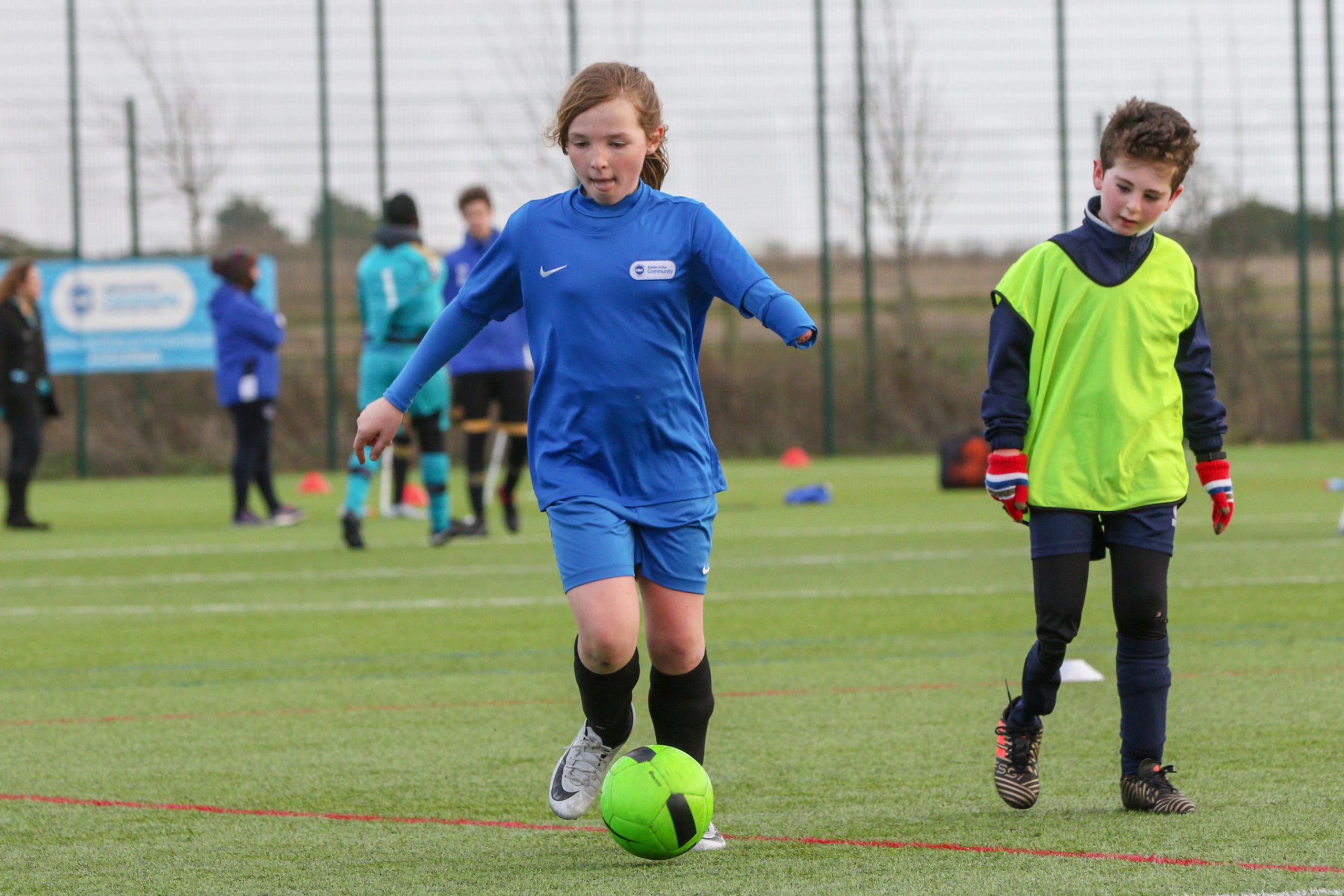 young kids having fun playing football