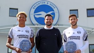 CEO Matt Dorn standing with Victoria Williams and Adam Lallana holding their awards