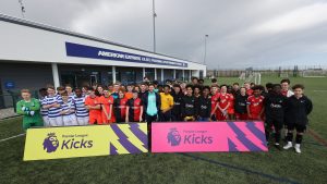 kids posing together for picture at premier league tournament