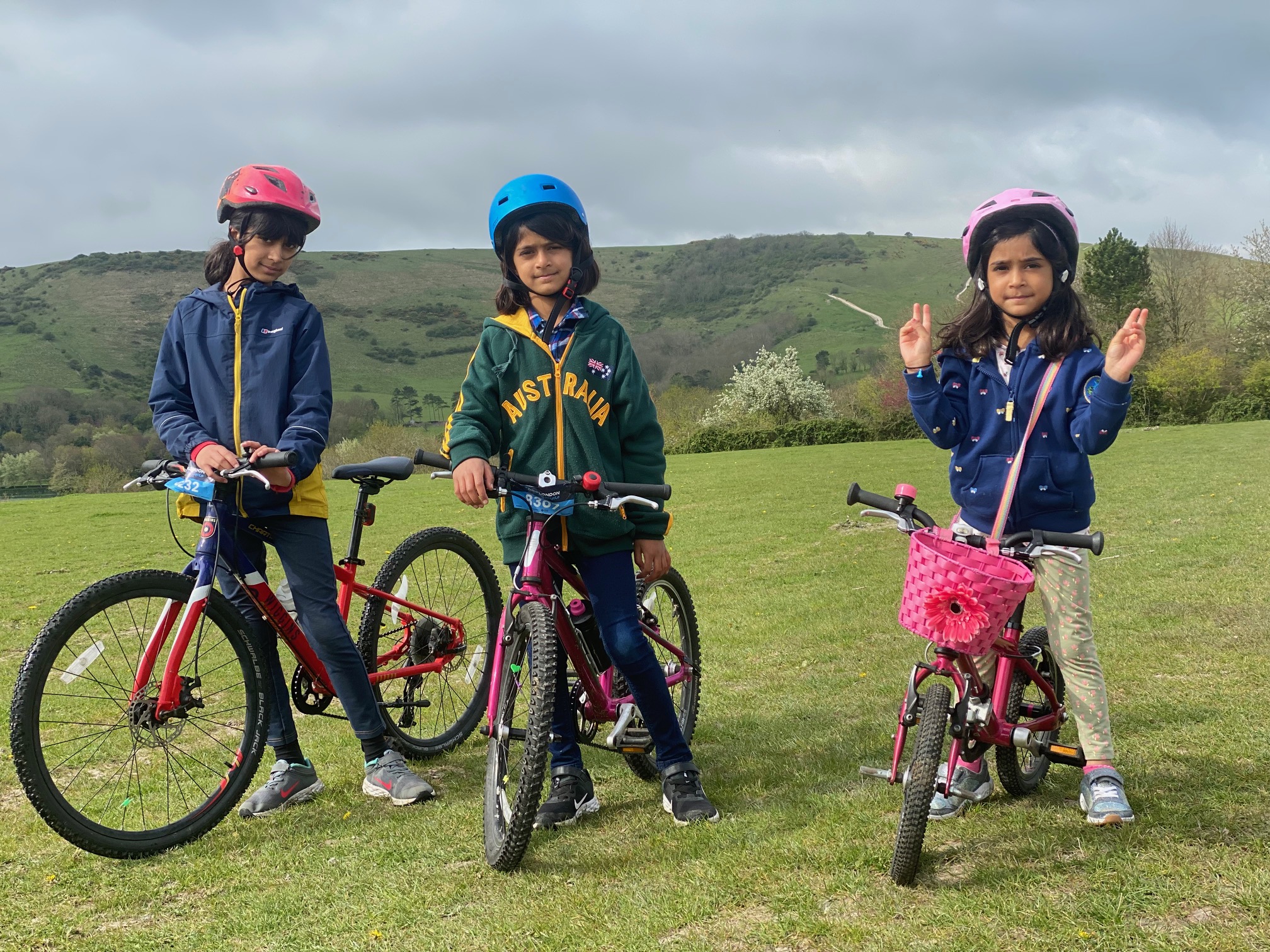 Three sisters raise hundreds for AITC on eight-mile cycle