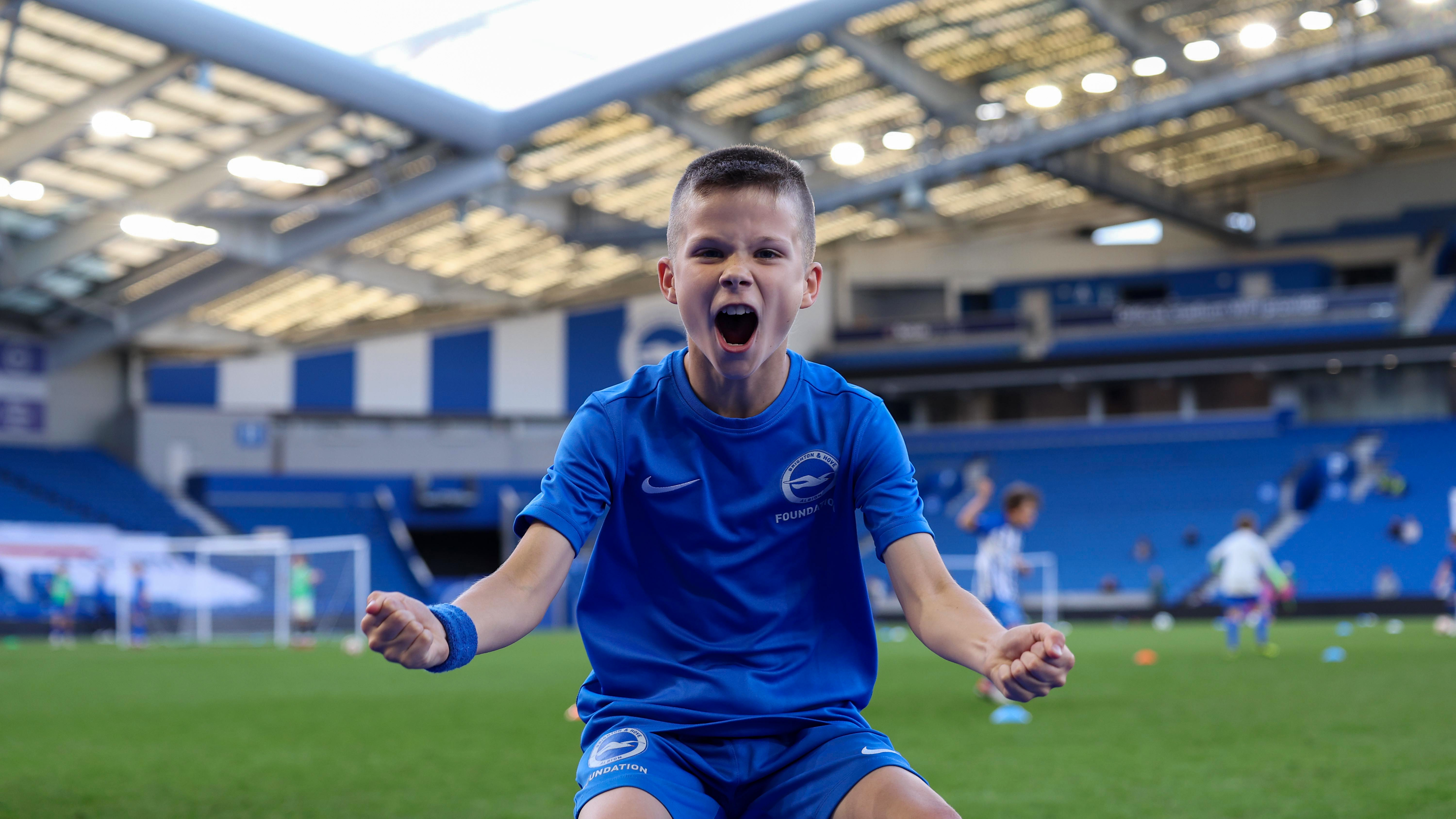 Hundreds of Sussex kids play on the Amex pitch