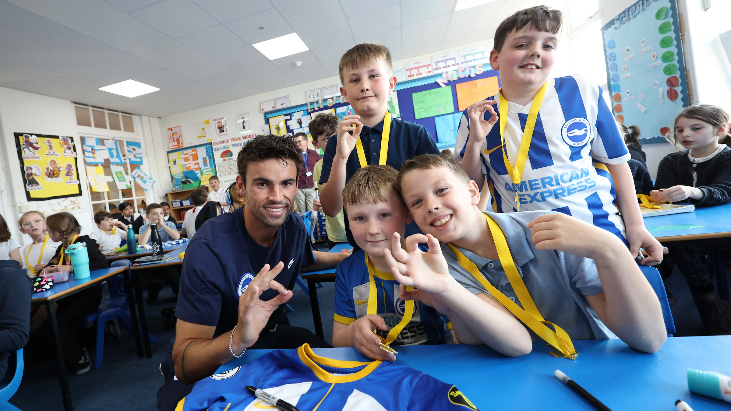 Matt O’Riley helps children learn sign language