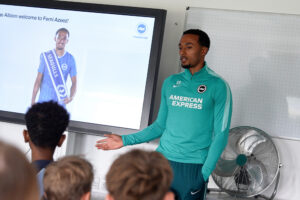 Femi Azeez talks to a class of students during a school workshop